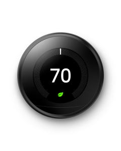 A photo showing a circular smart thermostat set to a temperature of 72. The outside of the circle has a metallic casing. 
